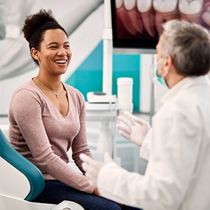 patient in a consultation with an implant dentist in Bettendorf