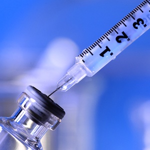 syringe removing BOTOX from a vial