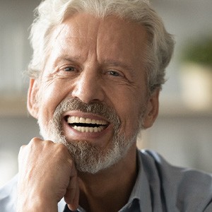 a dentures patient smiling brightly