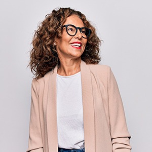 woman smiling while her dental implants in Bettendorf