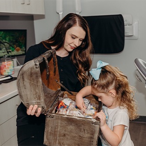 Woman in dental chair smiling