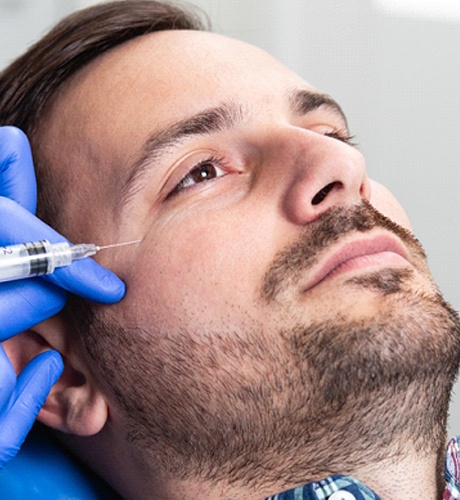 person getting BOTOX injections to remove crow’s feet