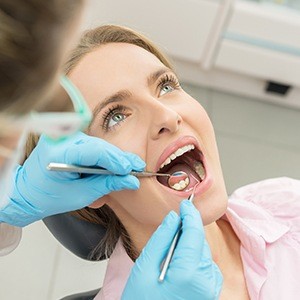 Woman receiving dental treatment