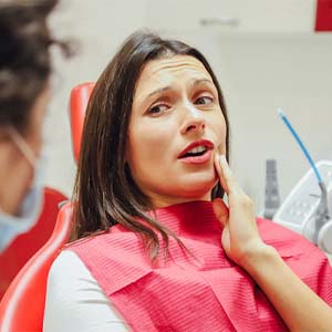 Woman in dental chair with dental emergency in Bettendorf
