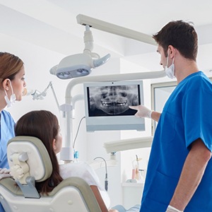 dentist showing a patient their dental X rays