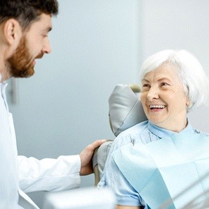 woman smiling with her dentist 