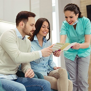 Patients checking in at reception desk