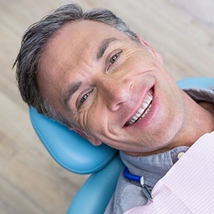 Smiling man in dental chair