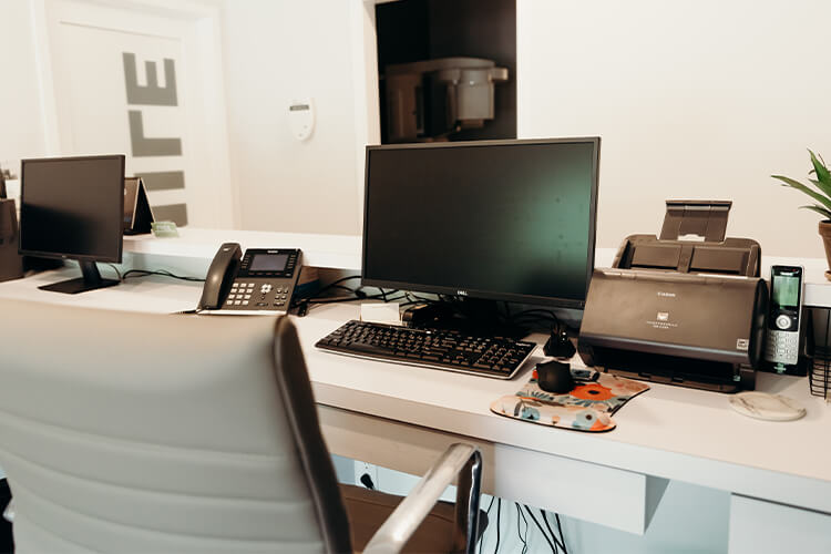 behind desk ofreception area