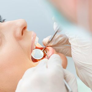 Patient completing exam in emergency dental office in Bettendorf