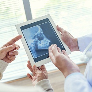 Jaw and skull bone x-rays on tablet computer