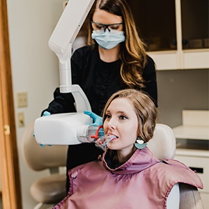 Pen pointing to dental x-rays