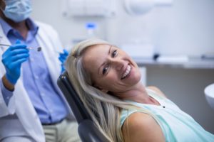 Woman who is relaxed smiling in dental chair