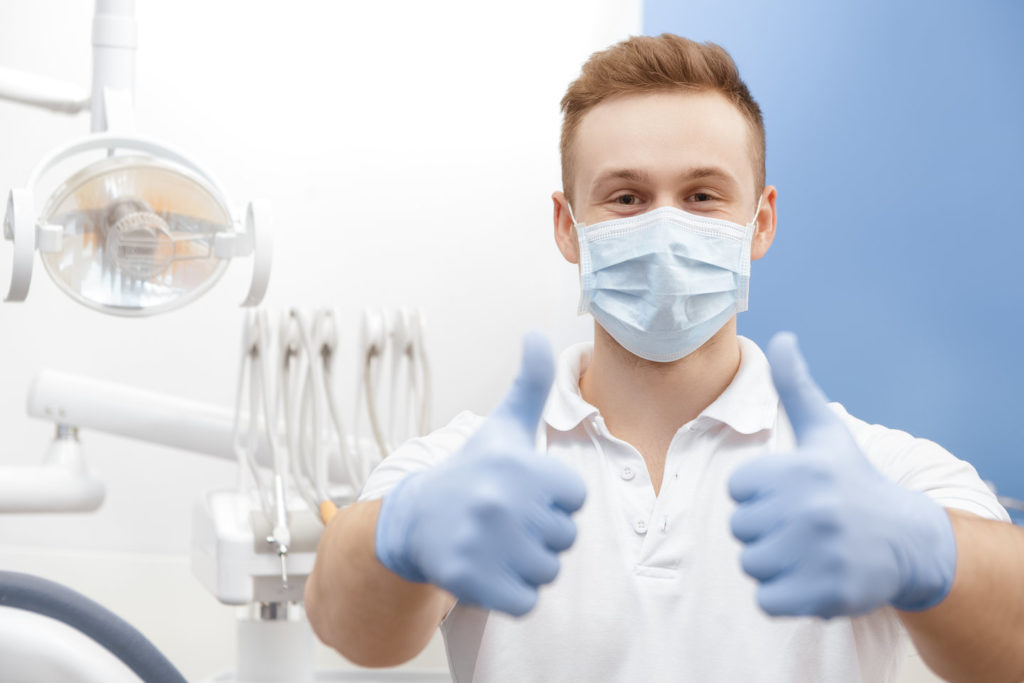 Dentist in Bettendorf talks to a patient about safety.