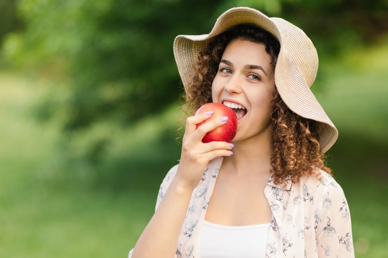 Woman eating an apple