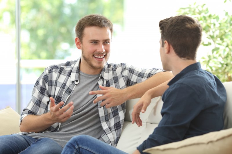 Invisalign patient talking to friend